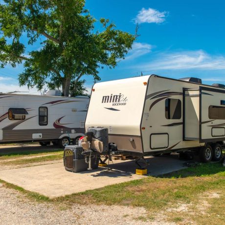 parked camper trailer at Lost River RV Park with grassy lots and clean concrete rv spaces