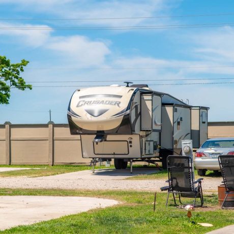 parked camper trailer at Lost River RV Park with grassy lots and clean concrete rv spaces