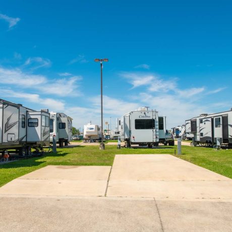 open concrete pad at Lost River RV Park with grassy lots and clean concrete rv spaces