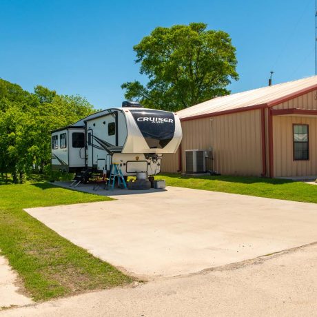 parked camper trailer at Lost River RV Park with grassy lots and clean concrete rv spaces