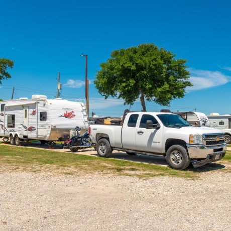 parked truck and trailer at Lost River RV Park with grassy lots and clean concrete rv spaces